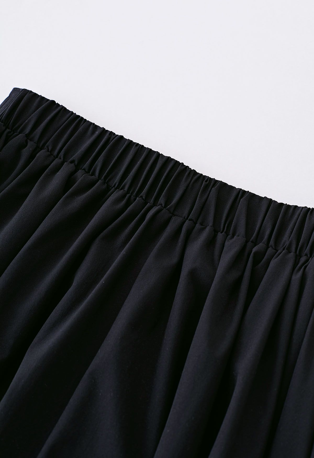 Notched Waist Flare Midi Skirt in Black