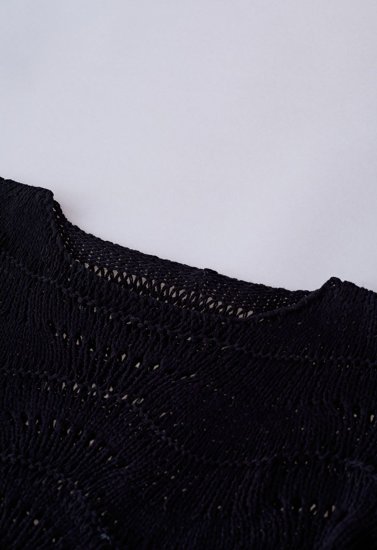 Wavy Line Openwork Knit Sweater in Black