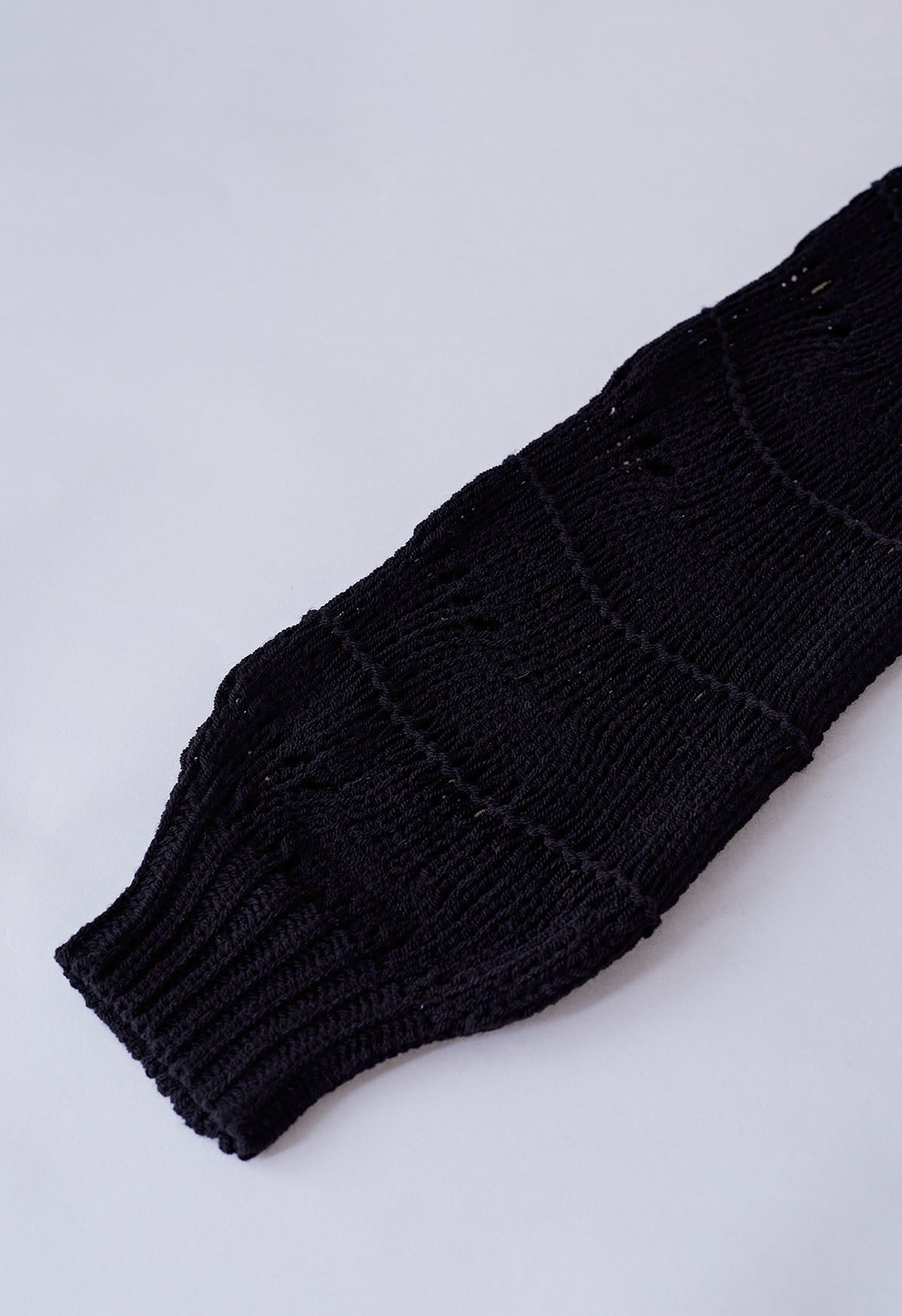 Wavy Line Openwork Knit Sweater in Black