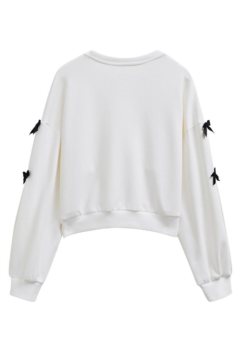 Bowknot Adorned Sleeve Cropped Sweatshirt in White